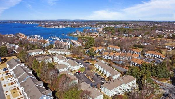 bird's eye view featuring a residential view and a water view