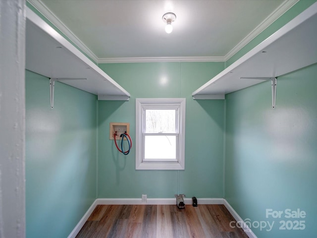 washroom featuring hookup for a washing machine, laundry area, crown molding, and wood finished floors
