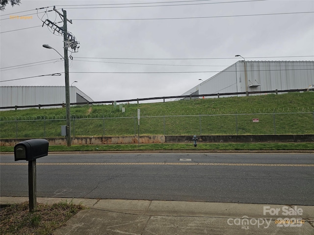 5315 Airport Dr, Charlotte, NC 28208 - view of street with sidewalks, curbs, and street lighting