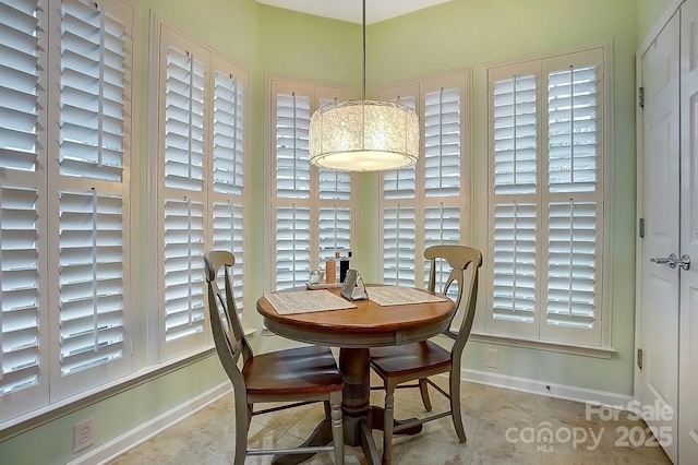 dining area featuring baseboards