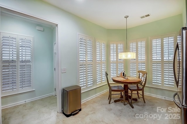 dining area featuring visible vents and baseboards