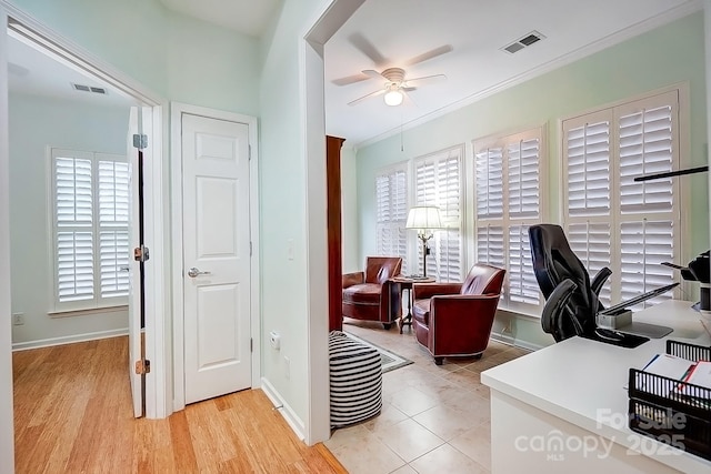 office featuring ornamental molding, visible vents, ceiling fan, and baseboards