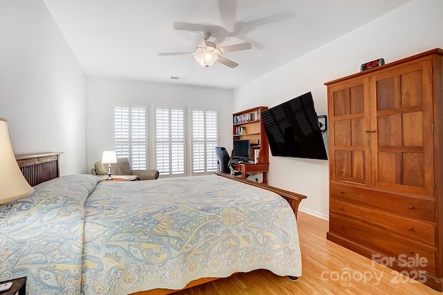 bedroom featuring light wood-style floors and ceiling fan