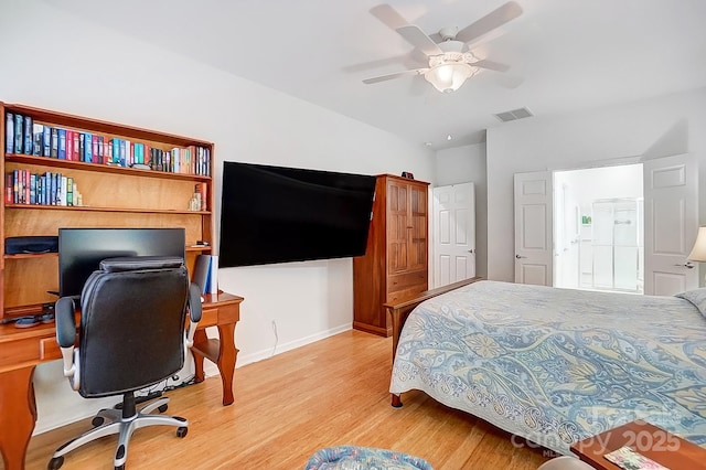 bedroom featuring baseboards, a ceiling fan, visible vents, and light wood-style floors