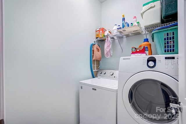 clothes washing area with laundry area and independent washer and dryer