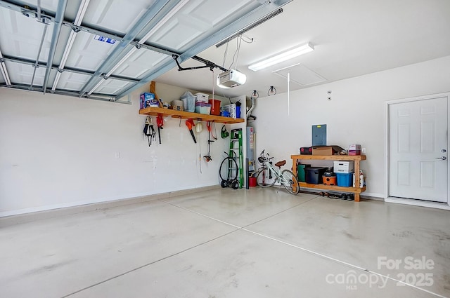 garage with baseboards and a garage door opener