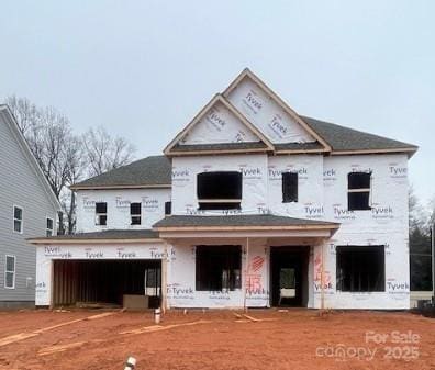 property in mid-construction featuring a garage