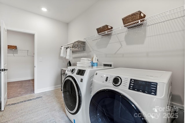 laundry area with baseboards, recessed lighting, separate washer and dryer, and laundry area