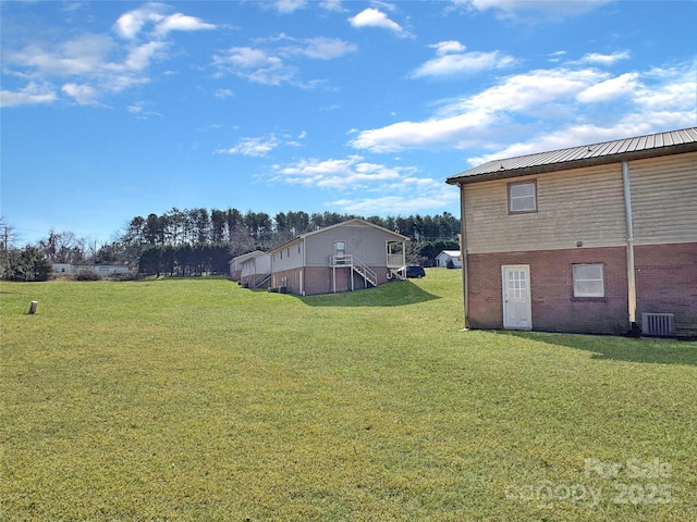 view of yard with central AC