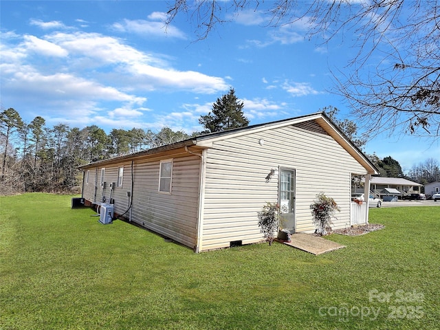 view of property exterior with central AC, crawl space, and a lawn