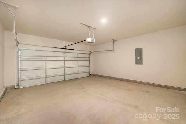 garage featuring electric panel, baseboards, and a garage door opener