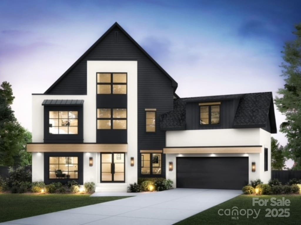910 Laurel Creek Ln, Charlotte, NC 28211 - modern home with driveway, stucco siding, an attached garage, and a front yard