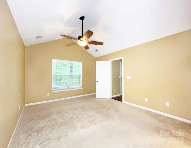 unfurnished room with baseboards, visible vents, lofted ceiling, ceiling fan, and carpet flooring