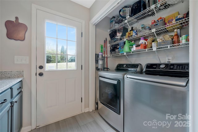 laundry area with independent washer and dryer