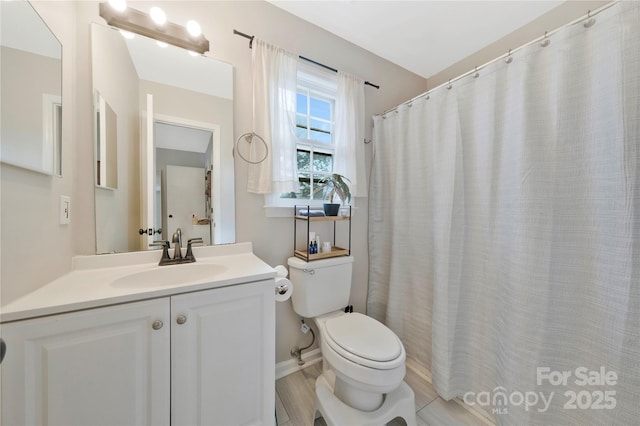 full bath featuring toilet and vanity