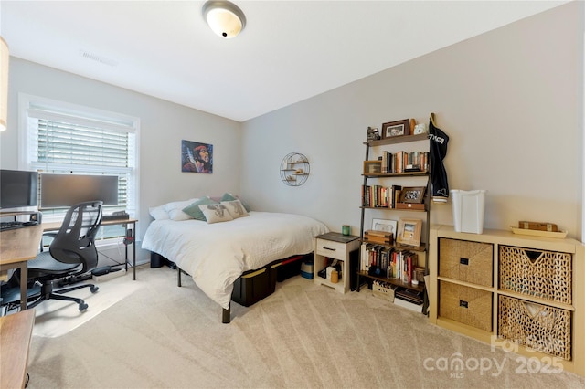 carpeted bedroom with visible vents