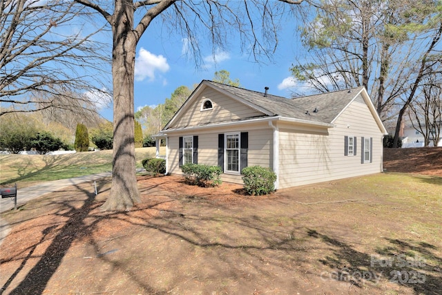 view of home's exterior featuring a lawn