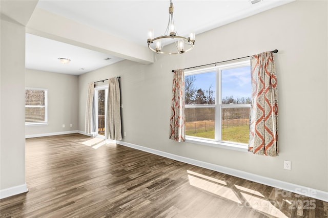 2504 Hovis Rd, Lincolnton, NC 28092 - unfurnished dining area featuring a chandelier, baseboards, and dark wood finished floors