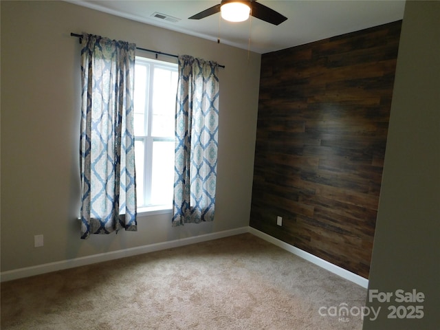 2504 Hovis Rd, Lincolnton, NC 28092 - carpeted spare room with wooden walls, ceiling fan, and baseboards