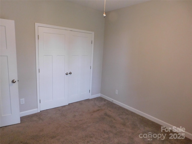 2504 Hovis Rd, Lincolnton, NC 28092 - unfurnished bedroom with carpet flooring, baseboards, and a closet