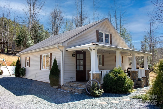 view of front of home with covered porch and metal roof