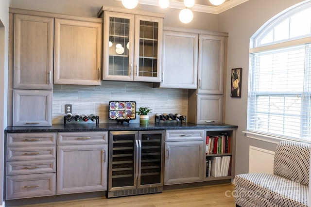 bar with plenty of natural light, wine cooler, and decorative backsplash