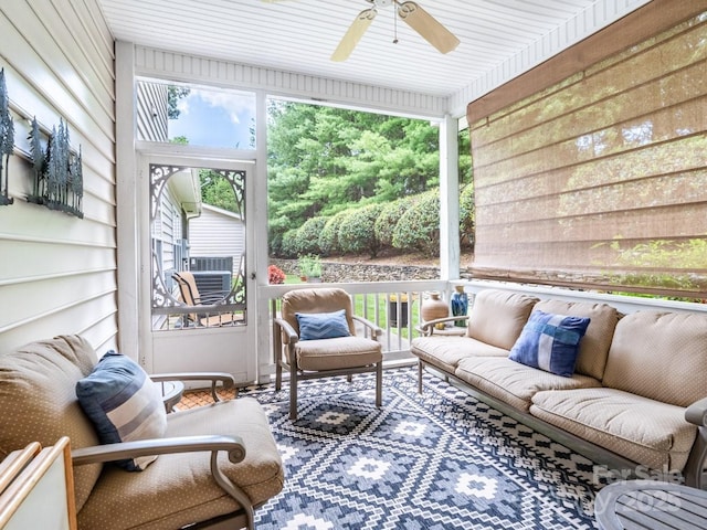 sunroom featuring a ceiling fan and a wealth of natural light