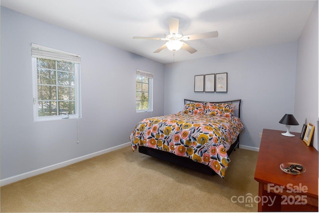 bedroom with ceiling fan, carpet, and baseboards