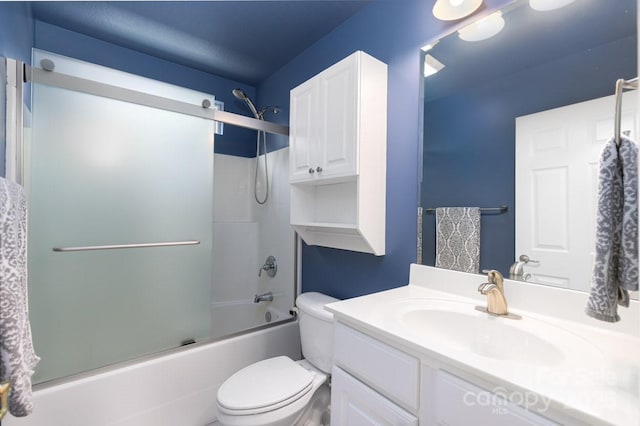 full bathroom with toilet, combined bath / shower with glass door, and vanity