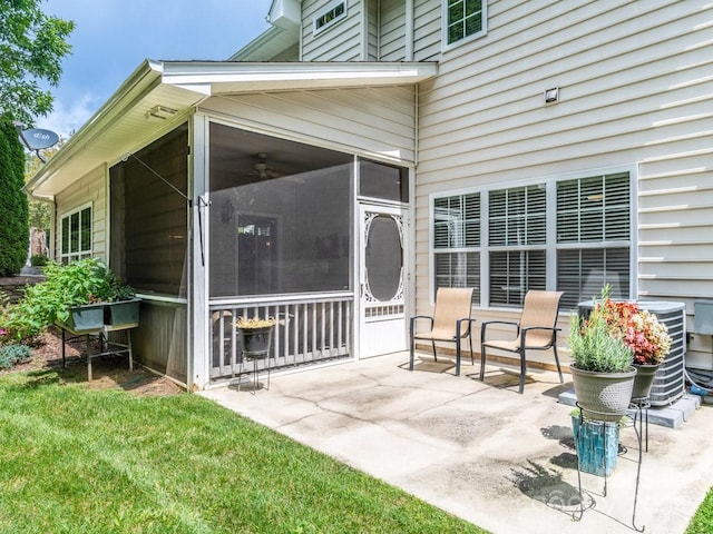 view of patio featuring a sunroom and cooling unit