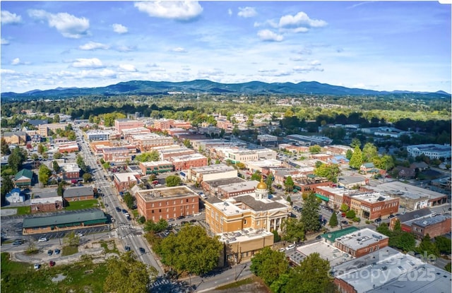 aerial view featuring a view of city and a mountain view