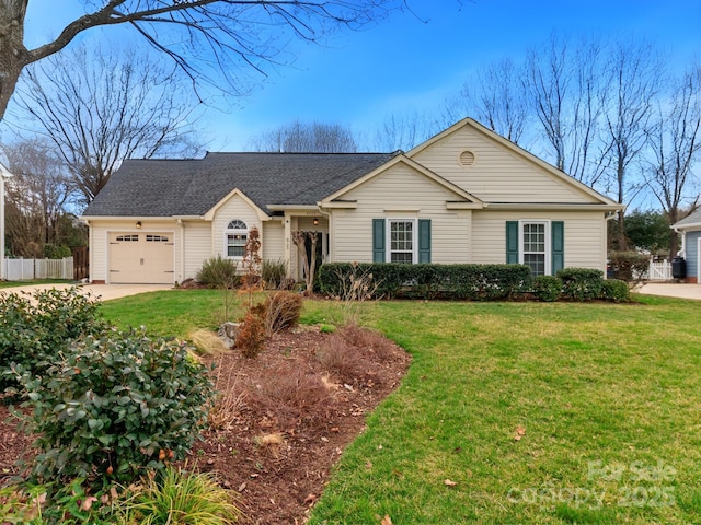 ranch-style home featuring a shingled roof, a front yard, fence, a garage, and driveway