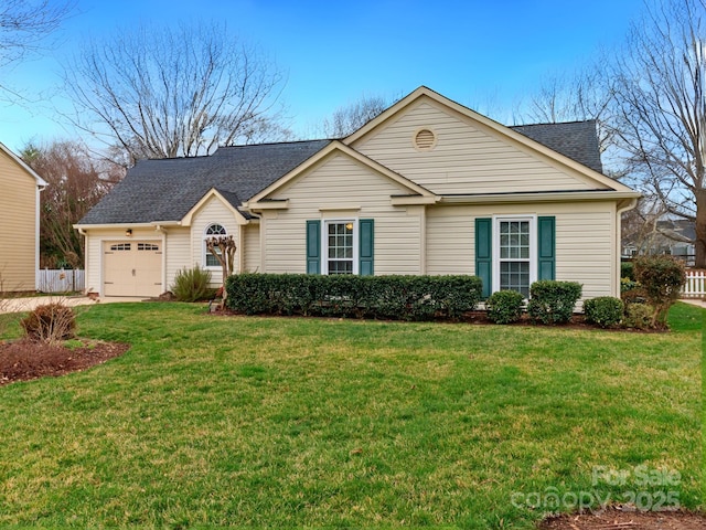 single story home featuring an attached garage, fence, a front lawn, and roof with shingles