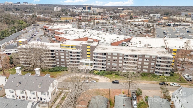 birds eye view of property featuring a city view