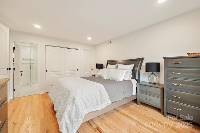 bedroom with a closet, recessed lighting, connected bathroom, and light wood-style floors