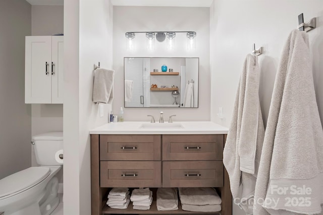 bathroom with toilet and vanity