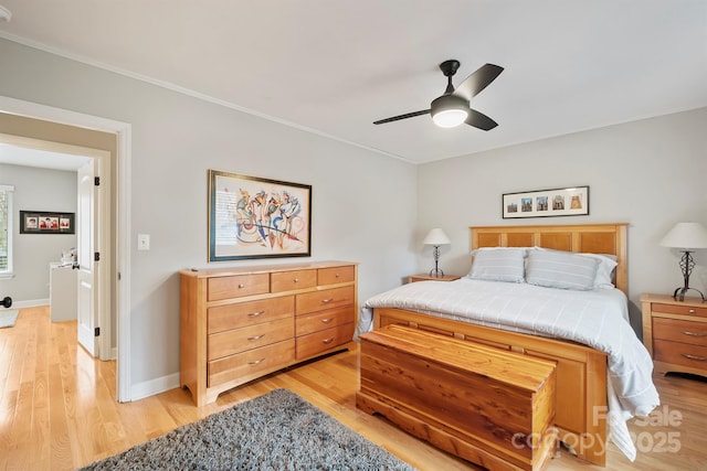 bedroom with light wood-style floors, baseboards, a ceiling fan, and ornamental molding