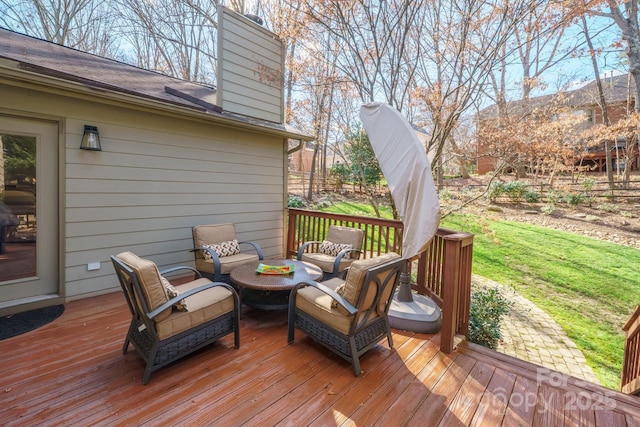 wooden deck with an outdoor living space