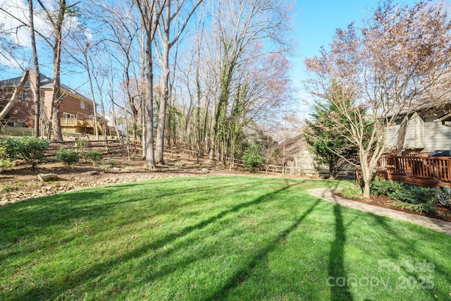 view of yard with a wooden deck