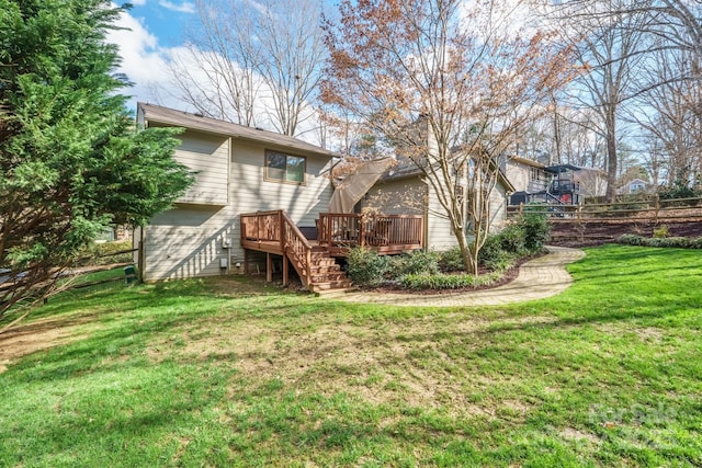 view of yard with stairway and a wooden deck