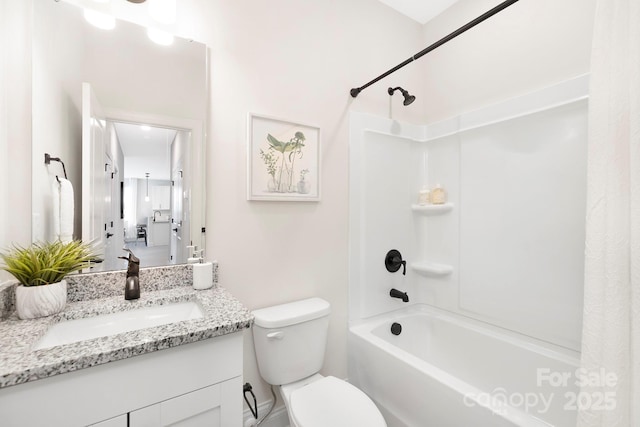 full bathroom featuring bathing tub / shower combination, vanity, and toilet