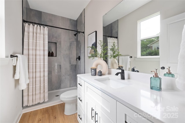 5404 Maplewood Ln, Charlotte, NC 28227 - full bathroom with vanity, a tile shower, toilet, and wood finished floors