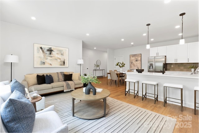 5404 Maplewood Ln, Charlotte, NC 28227 - living area featuring light wood finished floors and recessed lighting