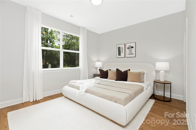 5404 Maplewood Ln, Charlotte, NC 28227 - bedroom with wood finished floors and baseboards