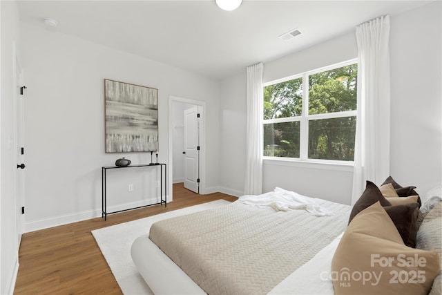 5404 Maplewood Ln, Charlotte, NC 28227 - bedroom featuring wood finished floors and baseboards