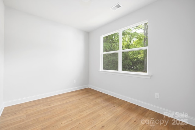 5404 Maplewood Ln, Charlotte, NC 28227 - empty room with baseboards and light wood finished floors