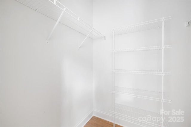 5404 Maplewood Ln, Charlotte, NC 28227 - walk in closet with wood finished floors