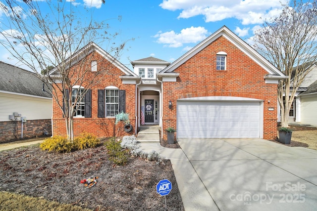 traditional home featuring a garage, brick siding, and driveway