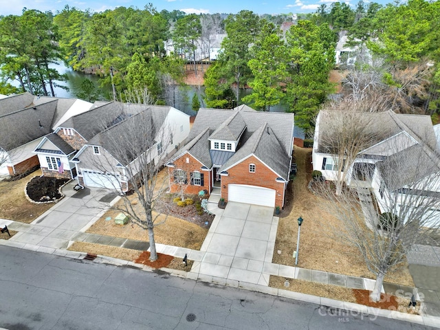 aerial view featuring a water view and a residential view