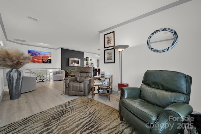 living room featuring wood finished floors and visible vents